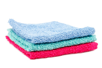 Stack of towels isolated on a white background.