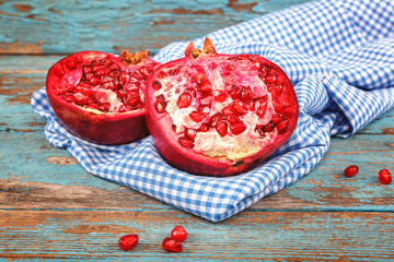 Pomegranate fruit on the a wooden boards