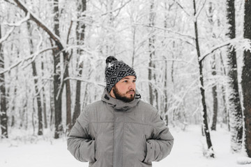 a man in a snowy forest