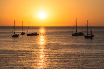Sailboats at sunset