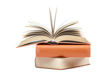 Books in a stack on white background.