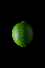 Lime isolated on black background.