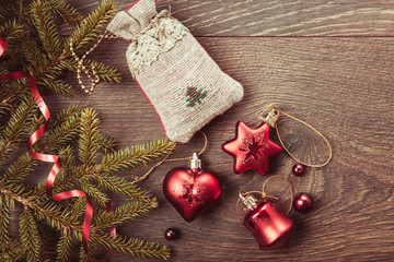 Christmas composition. Spruce branches, xmas tree, xmas pink decor holiday ball with ribbon on white background.