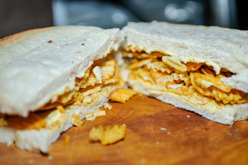 A crisp sandwich comprising a packet of ridged crisps inside two slices of plain or batch bread (including the heel, which everyone knows is the best part).