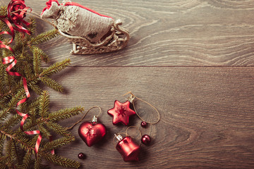 Christmas composition. Spruce branches, xmas tree, xmas pink decor holiday ball with ribbon on white background.