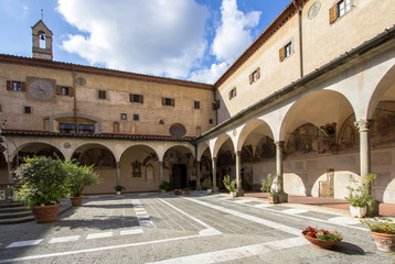 Fototapeta premium Exterior view (Courtyard) of the Basilica della Santissima Annunziata in Florence, Tuscany, Italy