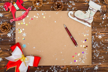 Christmas background.Kraft paper with copy space for holiday greetings, photo or text.Xmas festive card,letter for Santa.Top view.New Year holidays concept.