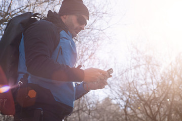 man with smartphone in nature