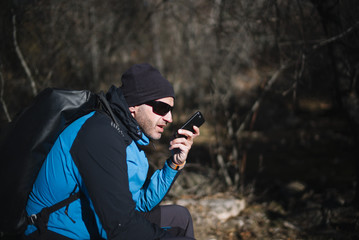 man with smartphone in nature