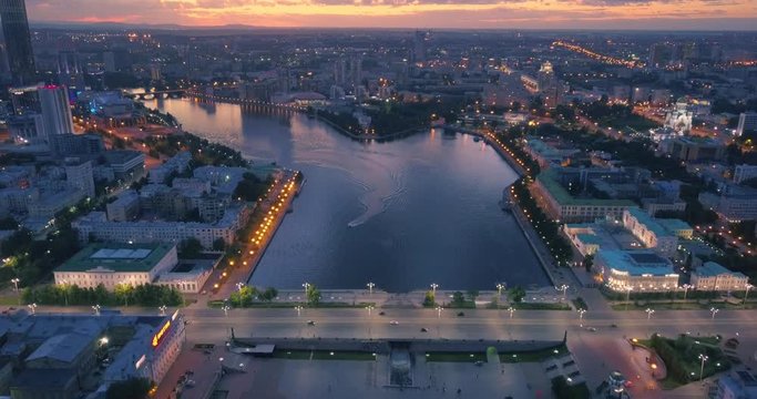 Aerial view of city center with river bank at sunset. Yekaterinburg, Russia.