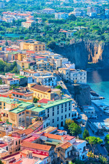 Cityscape of Marina Grande with houses and port Sorrento