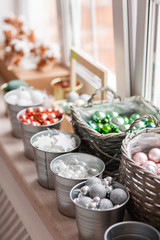 Many decorations. a lot of colorful, different Christmas toys ready to decorate the house. sorted by type in baskets