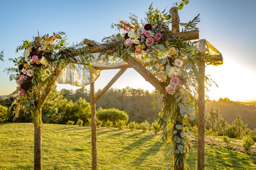 Jewish traditions wedding ceremony. Wedding canopy chuppah or huppah with golden light