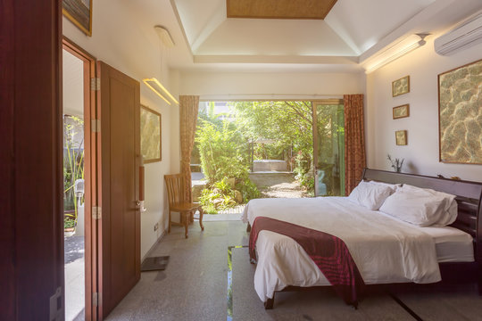 Luxury villa bed room interior. Open space, garden terrace