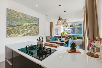 Modern kitchen and living room together interior in luxury villa