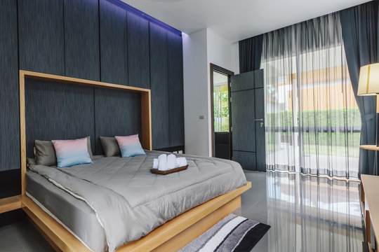Modern bed room interior in Luxury villa. Big window