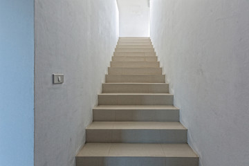 Fototapeta na wymiar White staircase in light villa interior