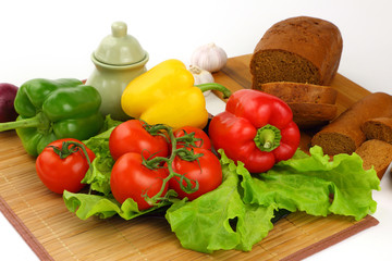 Still life with peppers, tomatoes and bread