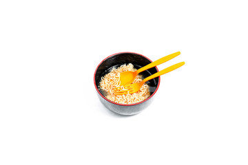 Instant noodles and cup isolated on white background.Instant noodles for people Do not like to eat vegetables.Instant noodles in black cup on white background.