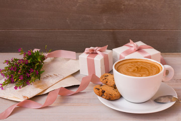 Wonderful morning on Valentine's day with cup of favorite coffee, gifts, flowers and letter from your beloved.