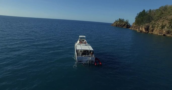 WHITSUNDAY ISLANDS – FEBRUARY 2016 : Aerial shot of diving boat on a beautiful day with divers and ocean in view