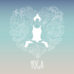 Obraz na płótnie Canvas Yoga logo. Girl practicing Lotus pose - Padmasana. Heart shaped paisley ornament. Light blue background.