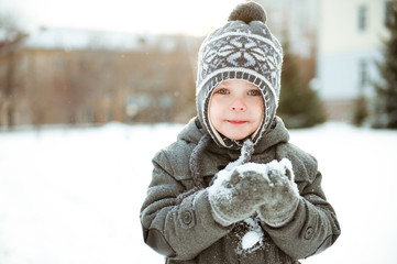 Portrait of a cute child in winter Park.