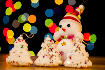 Festive snowman with Christmas light background
