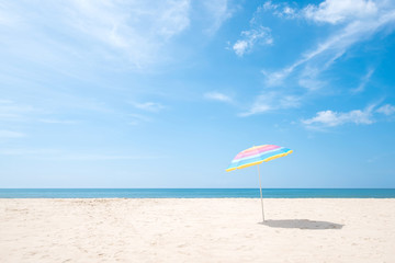 beach umbrella on the sandy beach on summer day.