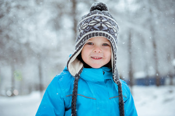 Portrait of a cute child in winter Park.