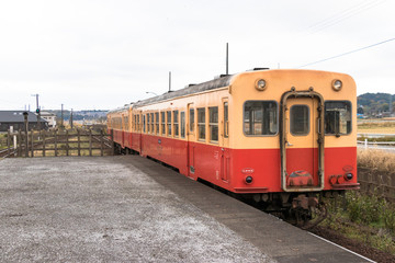 Obraz premium Local railroad running in the countryside of Chiba prefecture, Japan / Kominato railway running Ichihara city, Chiba prefecture