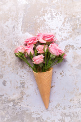 Fresh  pink roses flowers in waffle cone
