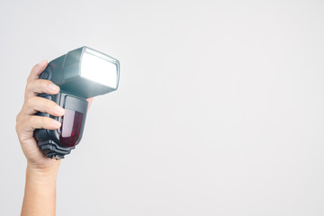 Hand holding camera  external flash speed light