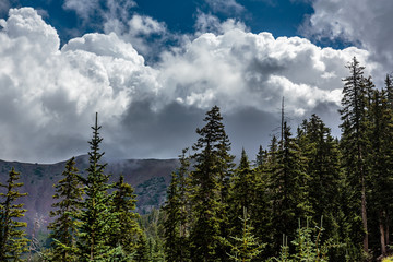 A monsoon storm gathers around the rim of the San Francisco Peaks near Flagstaff, Arizona.