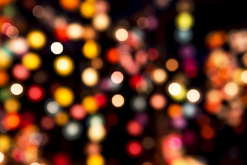 Abstract colorful light bokeh on black background, festive season or party light concept
