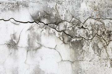 Abstract damaged concrete wall, crack texture on old white cement wall background