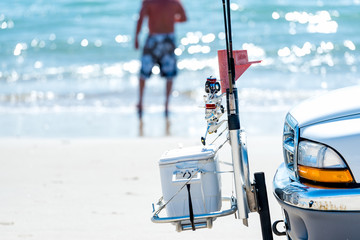 Fishing gear on front of truck on the beach - 185547995