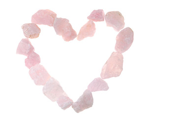 Pink quartz. heart made of pink quartz stones isolated on white background