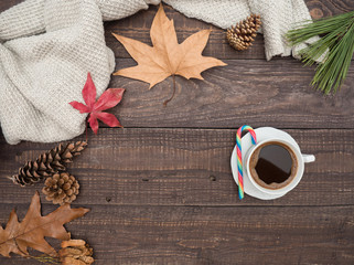 Hot coffee and colorful candy on a wooden table