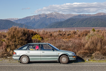 Fototapeta na wymiar New Zealand, a car at the side road