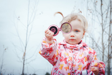 Portrait of a child of a little girl in a warm hat and warm clothes © keleny