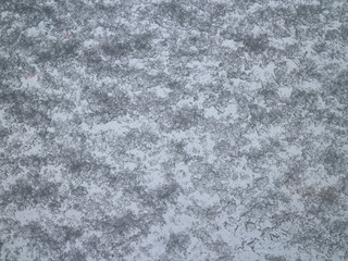 view of a window glass covered with wet snow