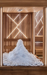 Snow room to cool the body after the sauna. A small snowdrift on the flor. Snow is falling from the...