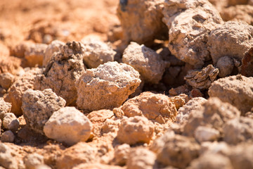 Red clay soil on nature as a background