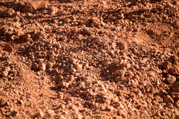 Red clay soil on nature as a background