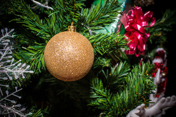 Closeup of Christmas decorations, gifts on Christmas tree, gifts, for new year background. vintage tone with copy space.