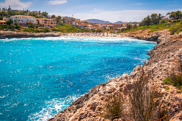 Fototapeta premium Turquoise lagoon at the coast of the Spanish island of Mallorca in the Mediterranean Sea, Europe.