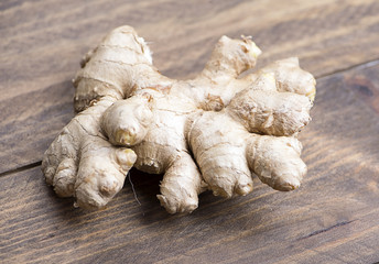 Ginger on wooden table. Food