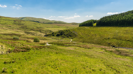 Welsh landscape and a country road near the Nant-y-Moch Reservoir, Ceredigion, Dyfed, Wales, UK