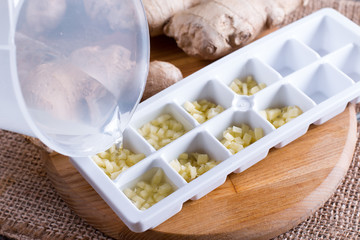 Frozen root of ginger with water